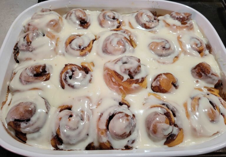 Pan of simple cinnamon rolls with white frosting