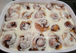 Cinnamon rolls covered with cream cheese frosting